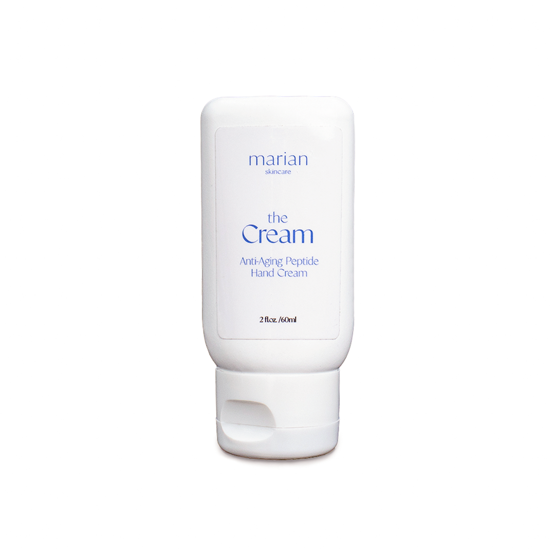 marian skincare the Cream, Anti-Aging Peptide Hand Cream; a small white bottle of hand cream, with a white label and periwinkle lettering that reads "marian skincare, the Cream, Anti-Aging, Peptide Hand Cream, 2 fluid ounces, 60 milliliters.".