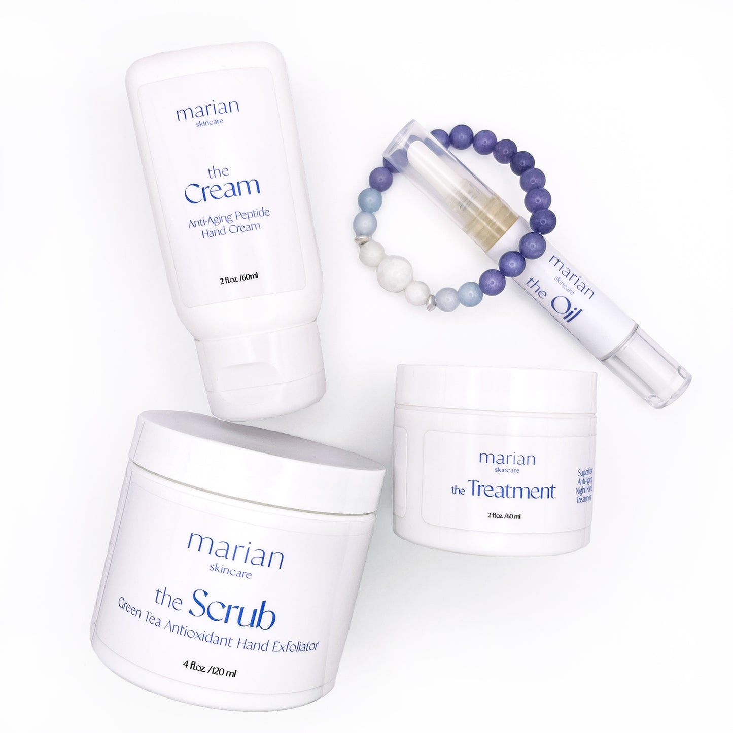 marian skincare holiday gift set includes the Cream, the Scrub, the Treatment, the Oil, and the Bracelet. Skincare for hands, hand cream, hand scrub, cuticle oil, crystal bead bracelet.